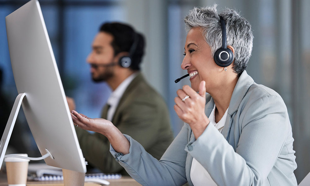 Contact center employee talking to customer