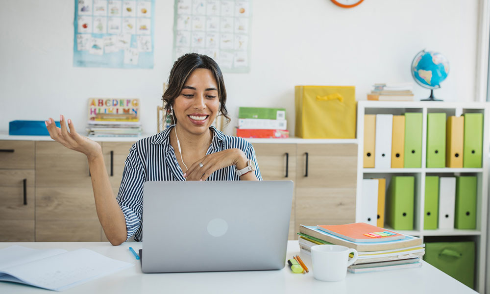 Teacher on teleconference call with parents