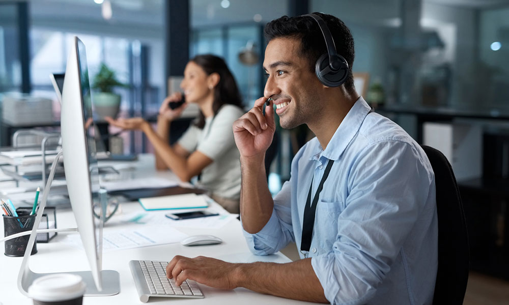 IT support staff on call with a client