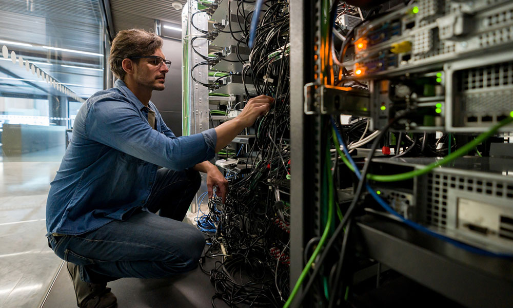 IT expert working in server room