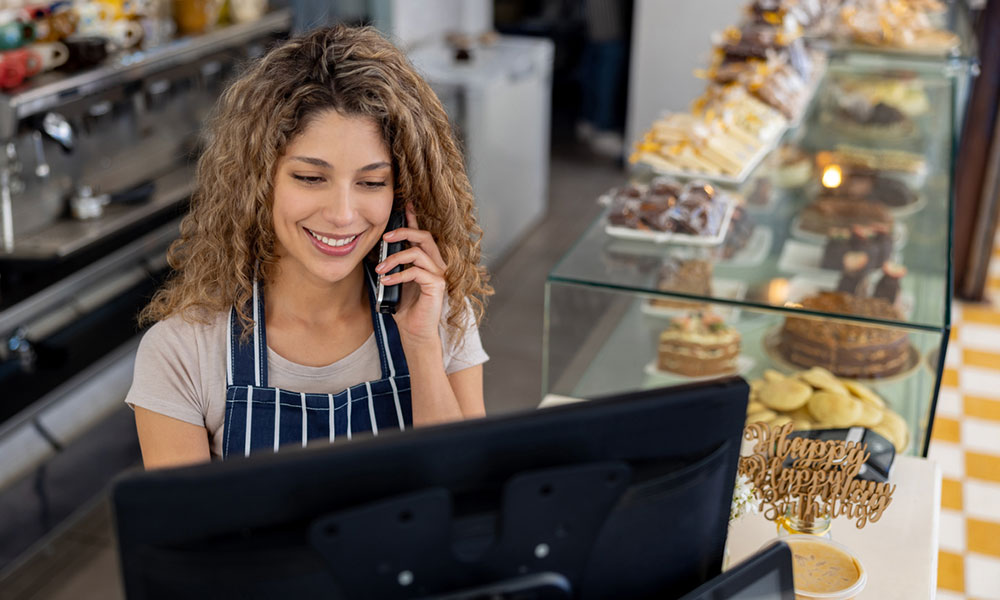 Retail worker using phone system